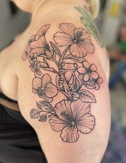 Tropical flowers with tree frog